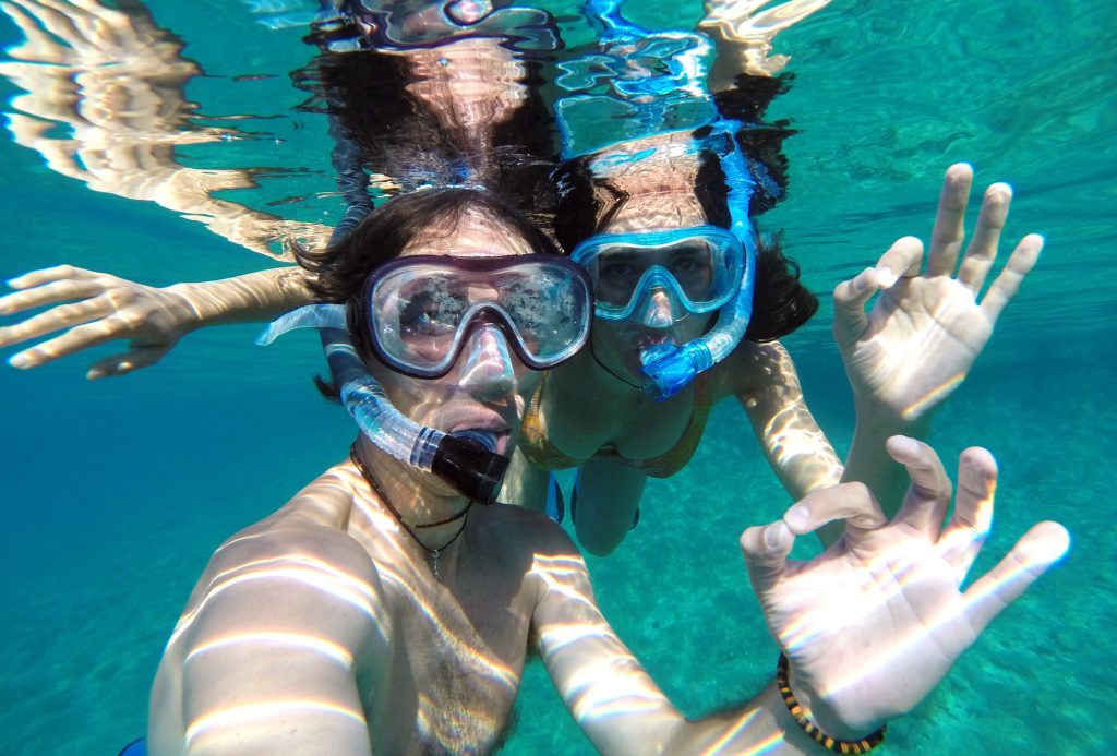 Underwater photo of a couple snorkeling in tropical sea