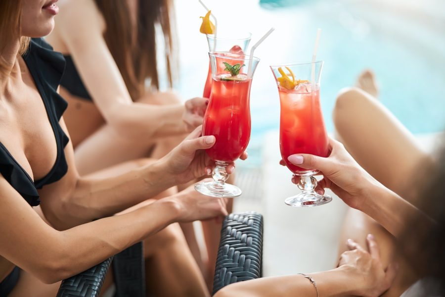 Cocktail hour at bachelorette party by the pool